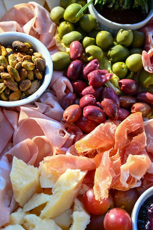 Charcuterie spread with prosciutto, olives and cheese